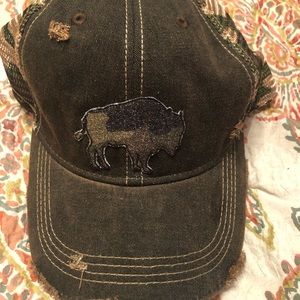 NWOT Woman’s distressed camo ball cap